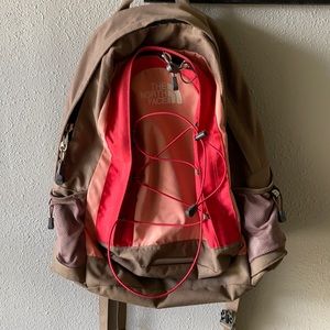 Pink and tan The North Face backpack.